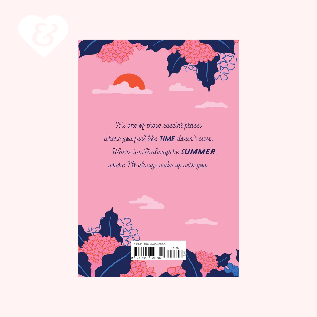 A pink greeting card or notebook cover featuring a floral illustration with navy blue leaves, pink flowers, a small orange sun, and white clouds. A quote is printed in the center, and a barcode label is at the bottom.
