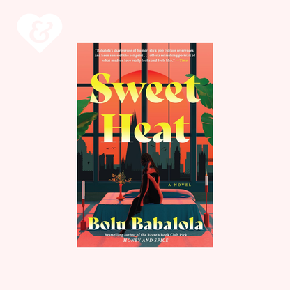 Book cover for the novel 'Sweet Heat' by Bolu Babalola, featuring a stylized illustration of a woman in a red dress standing on a red car in front of a window with a city skyline and palm leaves. The background of the image is a very light pink with a white heart icon in the top left corner.