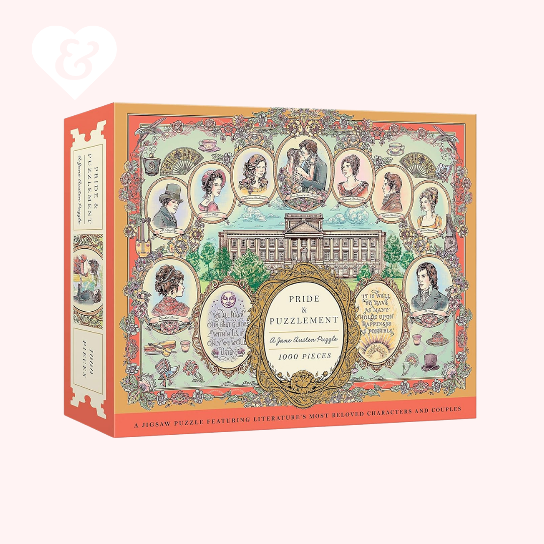 A boxed jigsaw puzzle titled 'Pride & Puzzlement' shown at a slight angle on a pale pink background. The box features an ornate vintage-style illustration with multiple portrait frames, decorative borders, and readable title text.