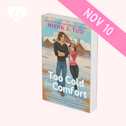 Book cover for 'Too Cold for Comfort' by Nisha J. Tuli, shown as a 3D mockup on a pale pink background with a pink 'NOV 10' banner overlay.