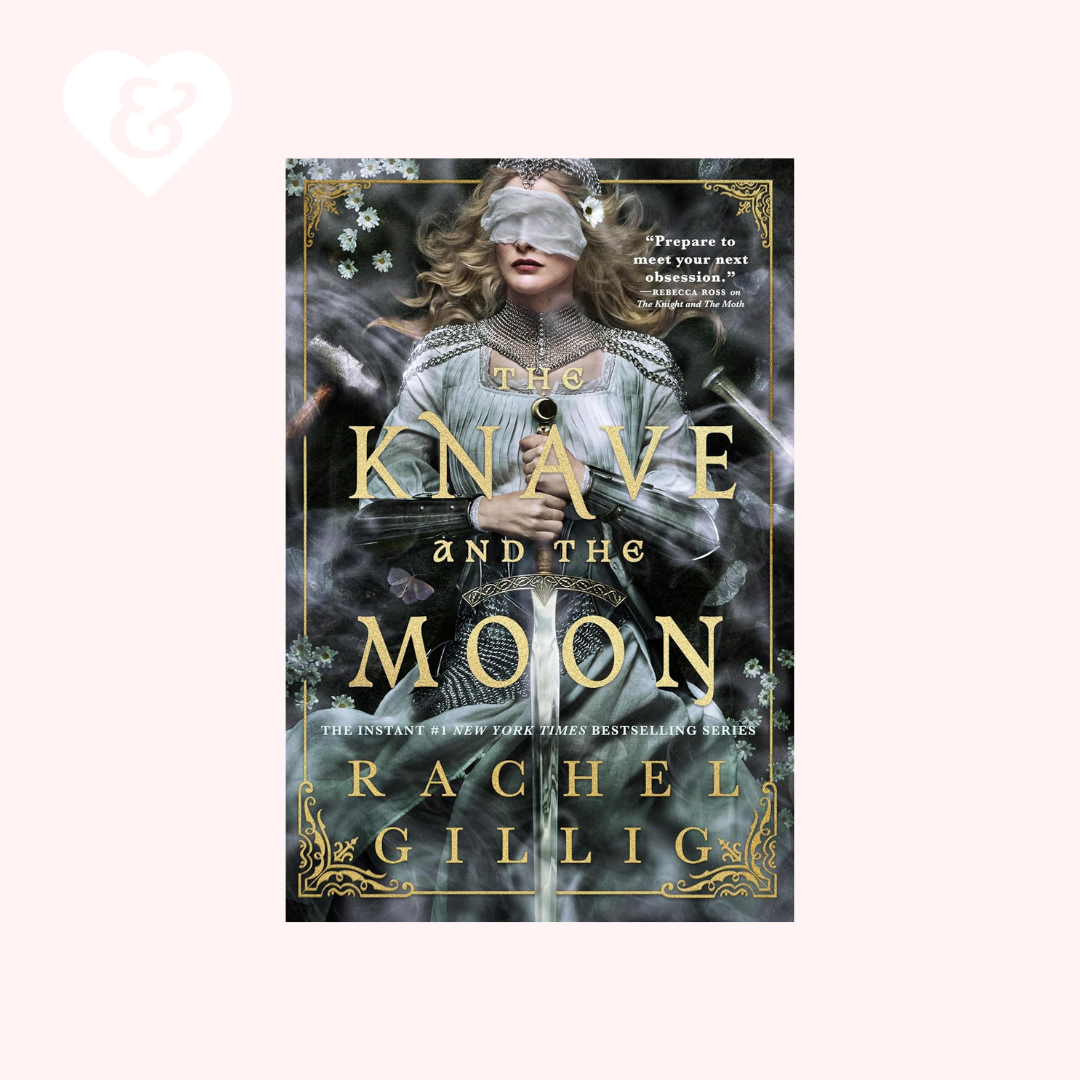 Book cover for 'The Knave and the Moon' by Rachel Gillig, featuring a blindfolded woman in a pale blue gown against a dark smoky background with gold title text and ornate gold border details, centered on a light pink background.
