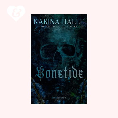 Book cover for 'Bonetide' by Karina Halle, featuring a dark, gothic design with a skull and blue-green gothic lettering, centered on a pale pink background with a white heart-and-key logo in the top-left corner.