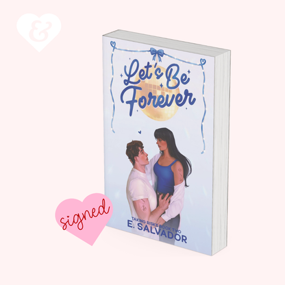 A 3D mockup of a paperback book titled 'Let's Be Forever' by E. Salvador, featuring a light blue cover with a couple on the front.