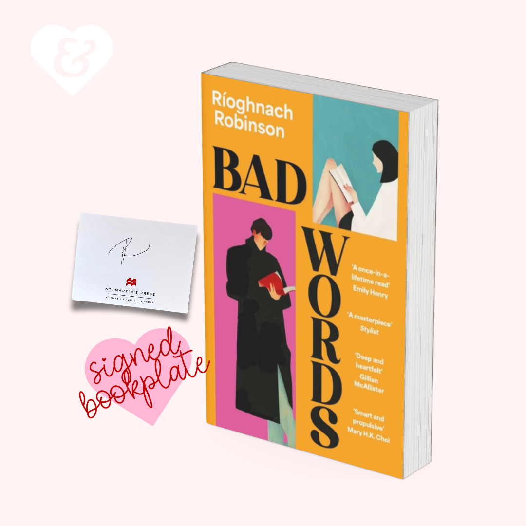 A book titled "Bad Words" by Rioghnach Robinson, shown standing upright next to a small white card and a pink heart-shaped "signed bookplate" on a pale pink background. The book cover features bold yellow, teal, and pink blocks with illustrated figures and large black title text.