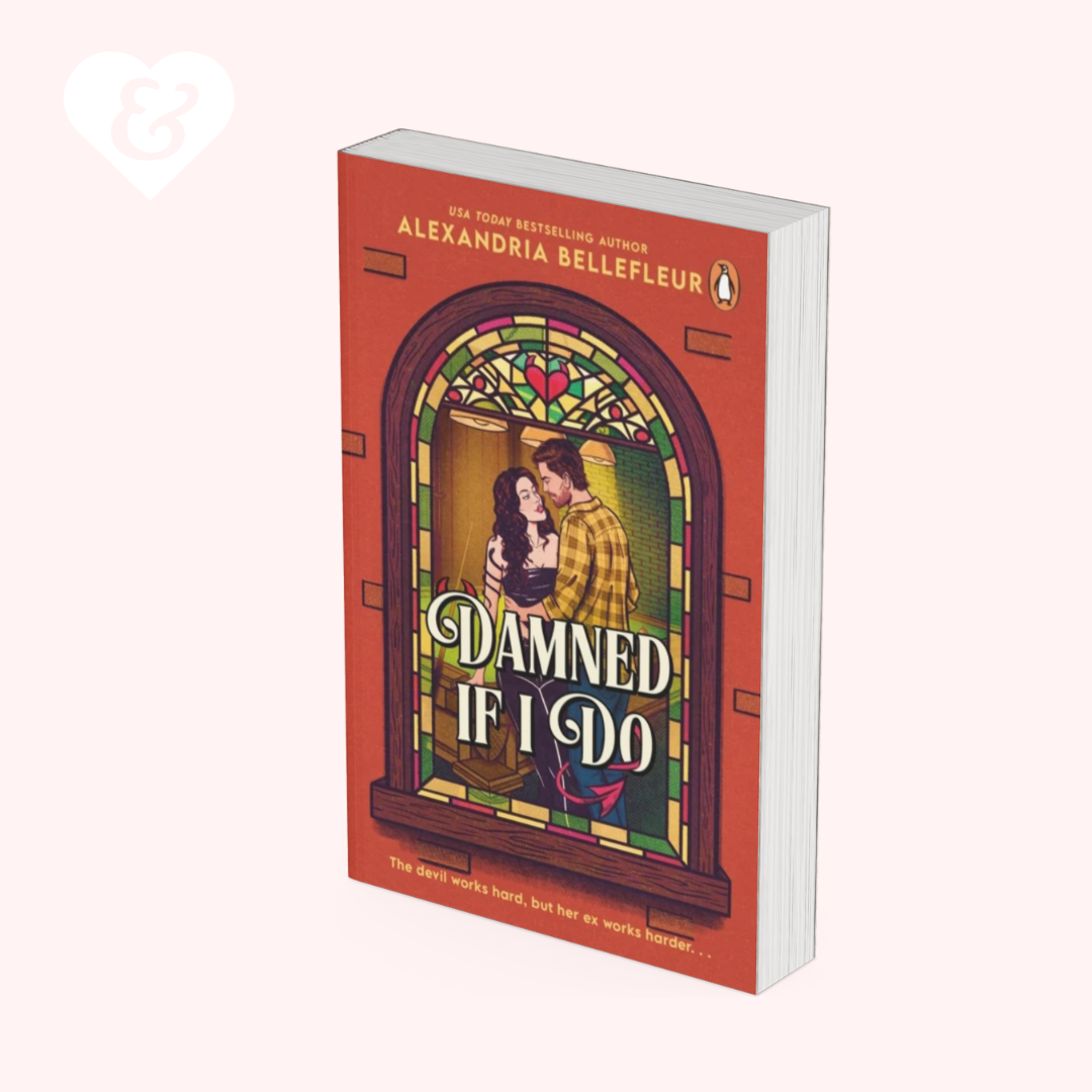 A book cover for 'Damned If I Do' by Alexandria Bellefleur, published by Penguin, shown at an angle on a pale pink background. The cover features a red-orange background with a stained-glass window illustration of a couple embracing.