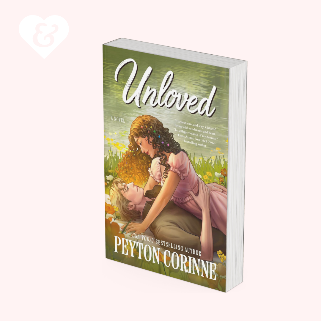 A book cover for the novel 'Unloved' by Peyton Corinne, featuring an illustration of a woman in a pink dress kneeling in a field and comforting a young girl. The book is shown at an angle against a pale pink background with a faint white heart logo in the upper left corner.