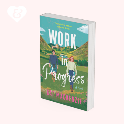 A 3D mockup of a paperback book titled 'Work in Progress' by Wat McKenzie, featuring a colorful illustrated cover with a couple walking in a field, set against a solid pale pink background.
