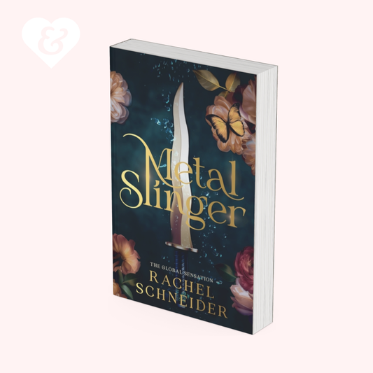 A book titled 'Metal Slinger' by Rachel Schneider, shown at a three-quarter angle against a pale pink background. The cover features a dark teal background with a vertical silver dagger, gold lettering, and illustrations of pink roses and a yellow butterfly.