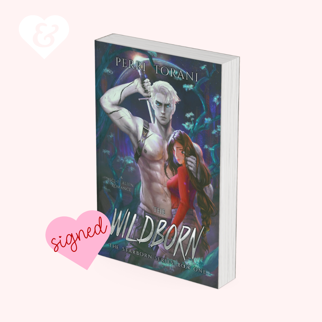 The book cover of 'The Wildborn' by Perri Torani, featuring a muscular pale blonde man holding a sword and a woman in a red dress, set against a dark blue and purple background. The book is displayed on a light pink background with a pink 'signed' heart graphic and a white heart logo in the corners.
