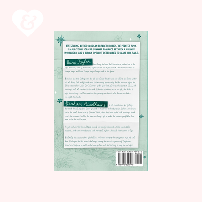 The back cover of a book shown against a pale pink background. The cover is light green with dark green text blocks, decorative snowflake accents, and a barcode at the bottom right.