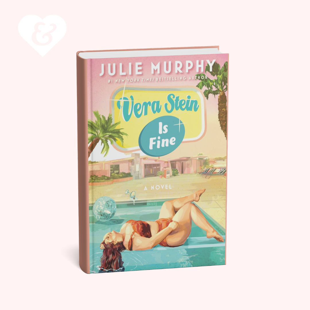 A 3D mockup of the book cover for 'Vera Stein Is Fine' by Julie Murphy, displayed against a solid pale pink background. The cover features a retro 1950s-style illustration with a woman lounging by a pool, palm trees, and a retro sign.