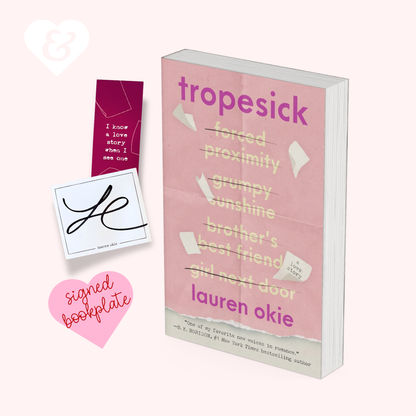 Book titled 'Tropesick' by Lauren Okie with a bookplate and heart-shaped sign on a white background