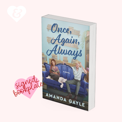 Book cover for the novel 'Once, Again, Always' by Amanda Gayle, shown as a 3D book mockup on a pale pink background with a pink heart-shaped 'signed bookplate' graphic and a white heart logo in the corner.