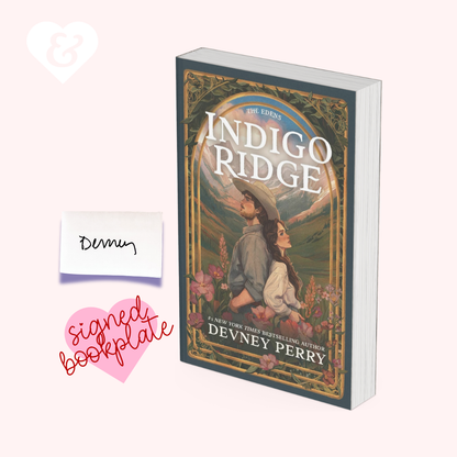 The book 'Indigo Ridge' by Devney Perry is shown on a pale pink background with a small handwritten note reading 'Denny' and a pink heart that says 'signed bookplate'.