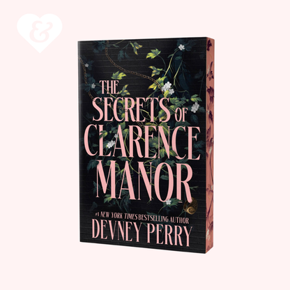 The book cover of 'The Secrets of Clarence Manor' by Devney Perry, featuring a dark background with pink lettering and green floral vines, shown on a light pink background.