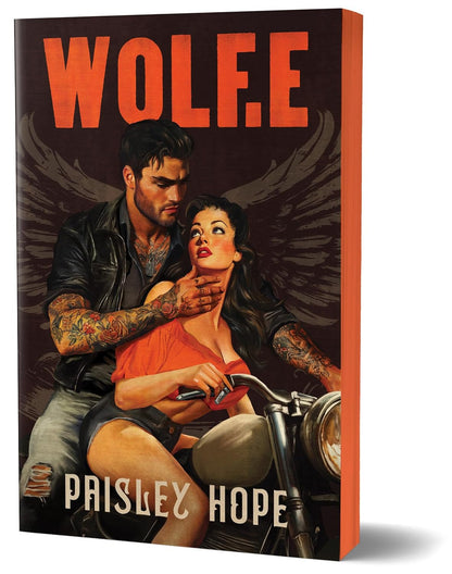 Book cover of 'WOLFE' by Paisley Hope with a couple on a motorcycle.