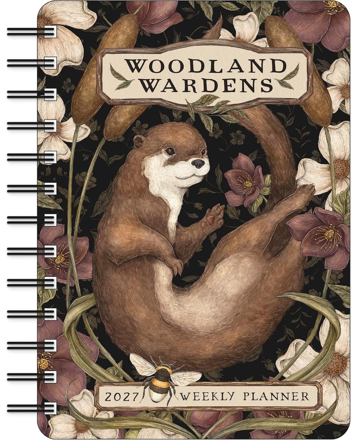 Woodland Wardens 2027 Weekly Planner notebook featuring an illustrated brown otter surrounded by flowers and leaves on a dark background, with spiral binding visible along the left side.