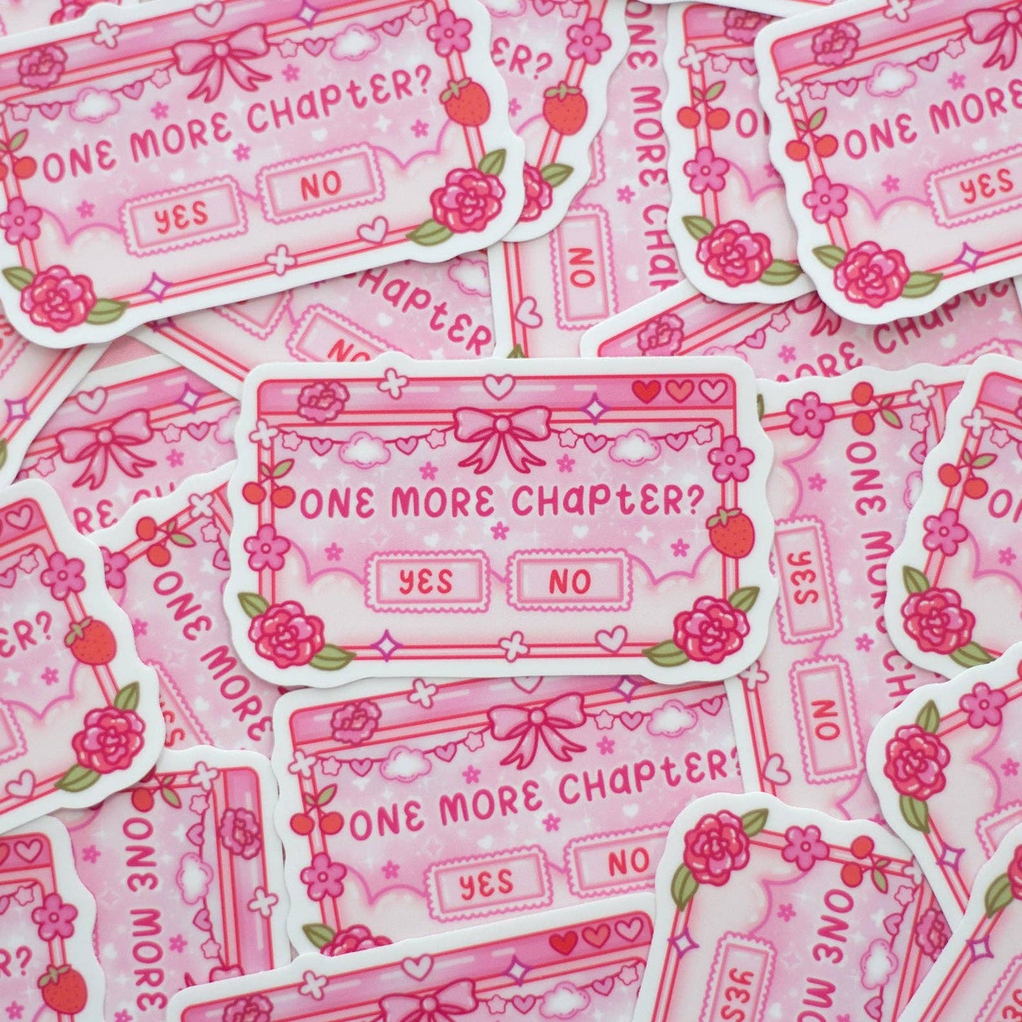 Pink stickers with 'One More Chapter?' design on a pink background