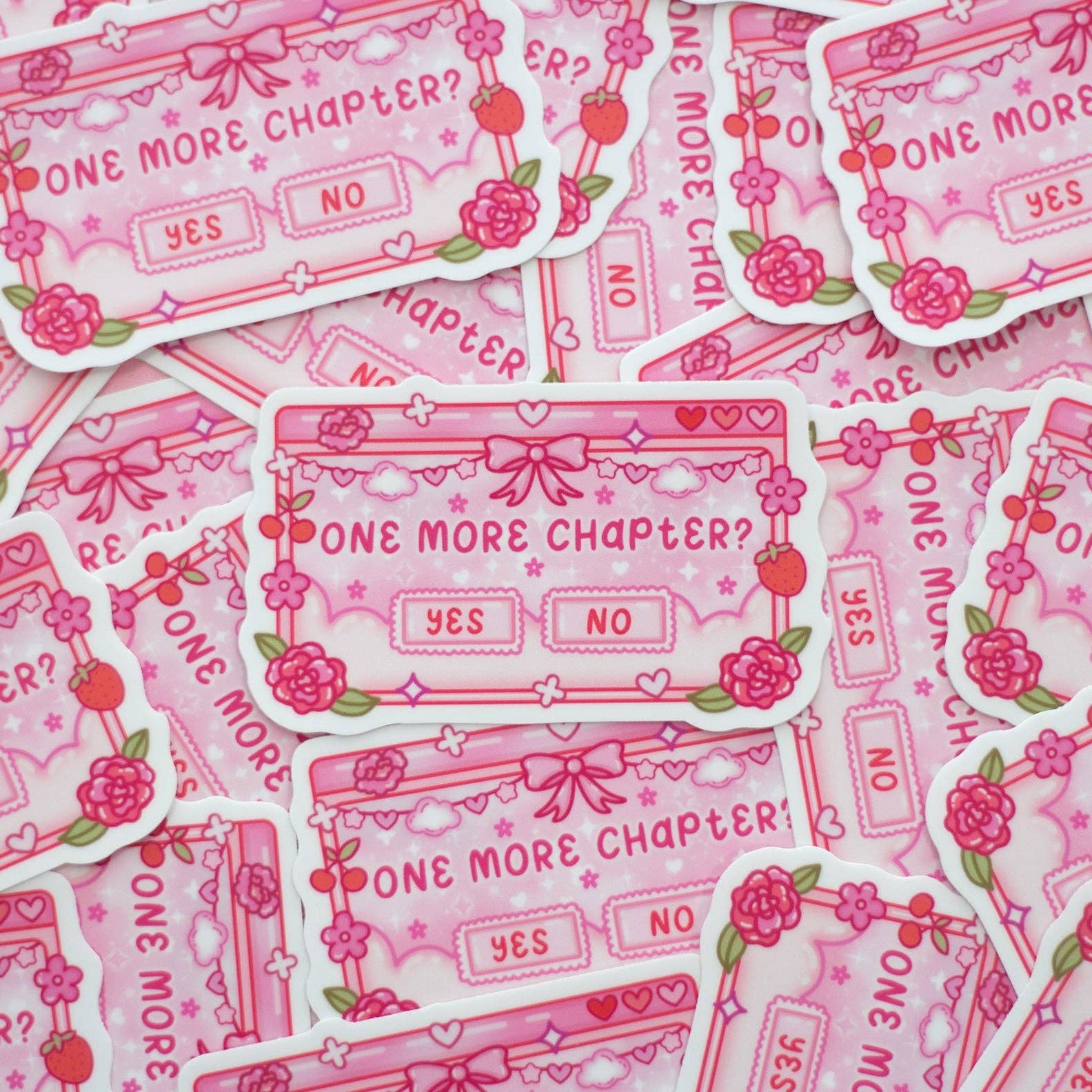 Pink stickers with 'One More Chapter?' design on a pink background