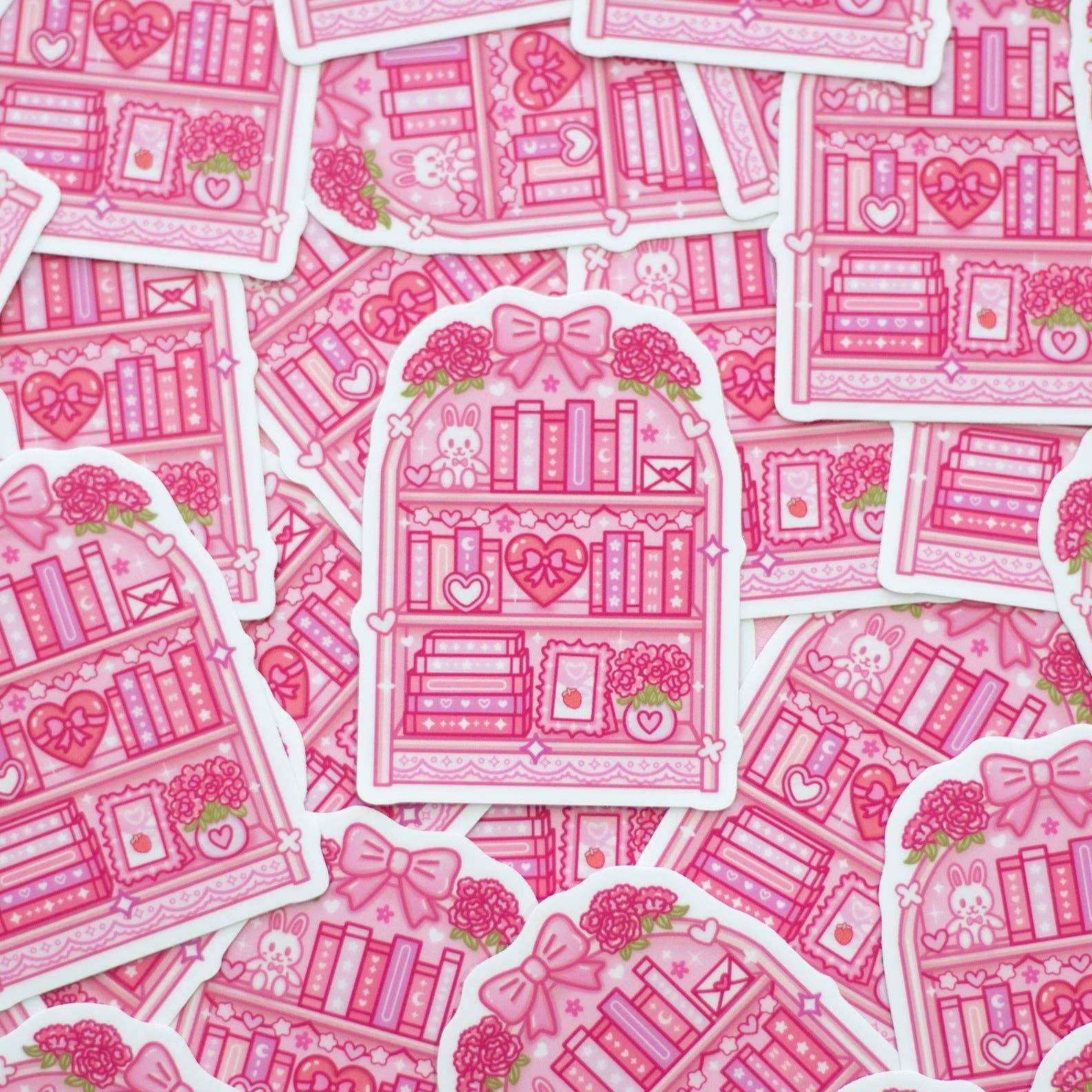 Pink illustrated bookshelves with hearts and flowers on a white background