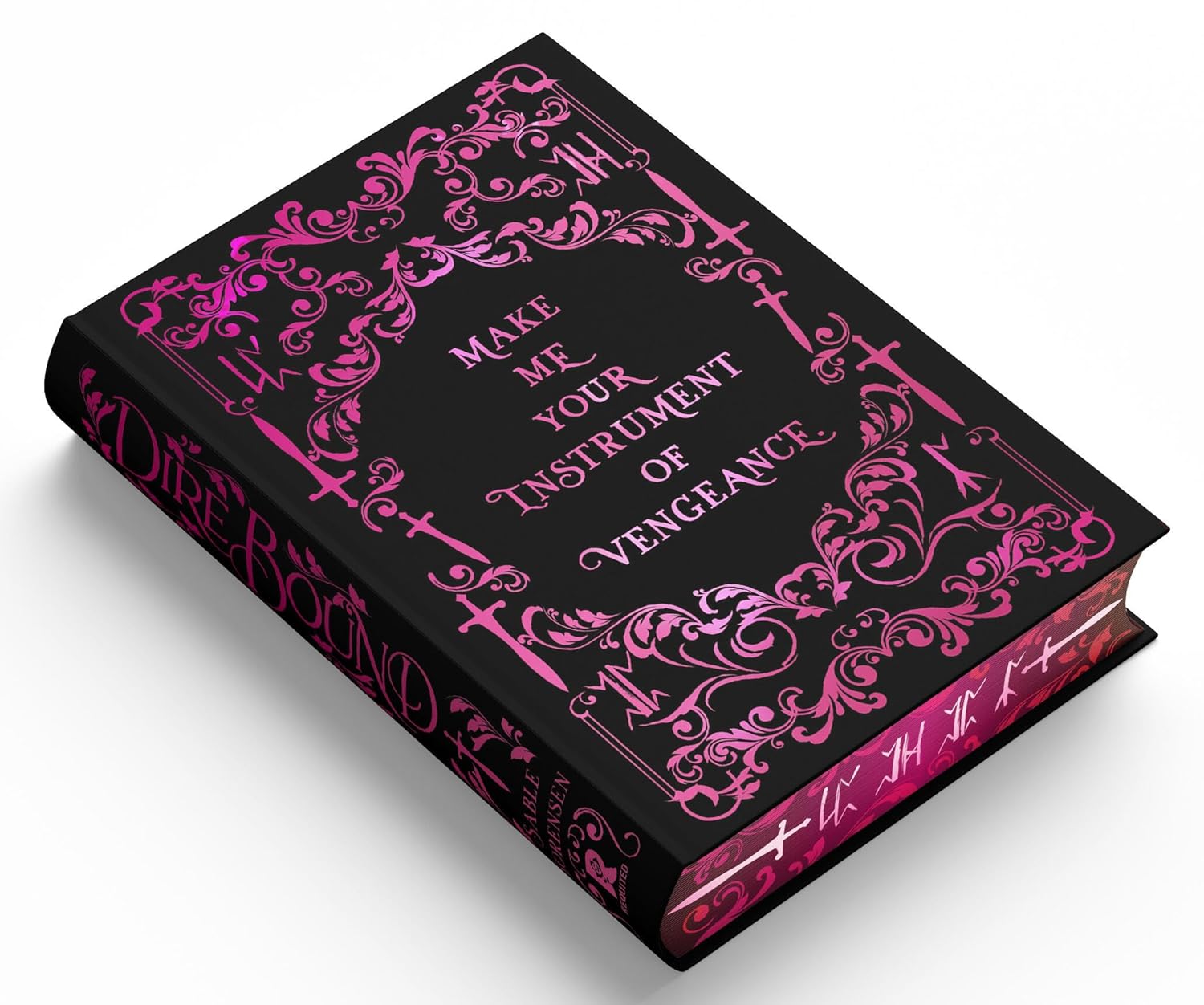 Book with ornate pink designs and text on a black background
