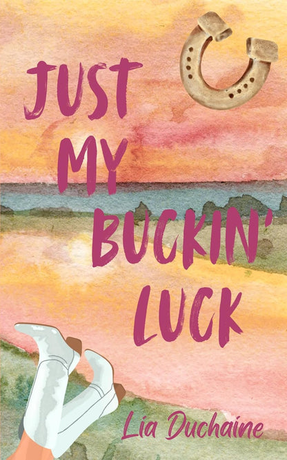 Book cover for 'Just My Buckin' Luck' by Lia Duchaine, featuring a watercolor landscape with pink and orange sky, a horseshoe, white boots, and pink title text.