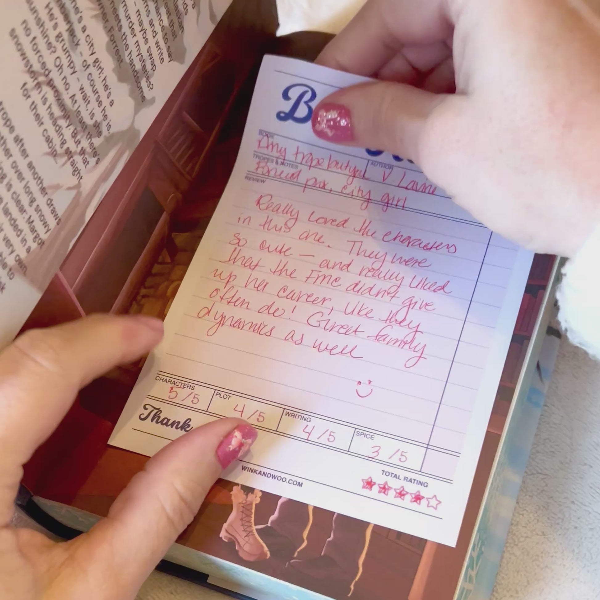 Writing in a book review tablet and putting it in a book.