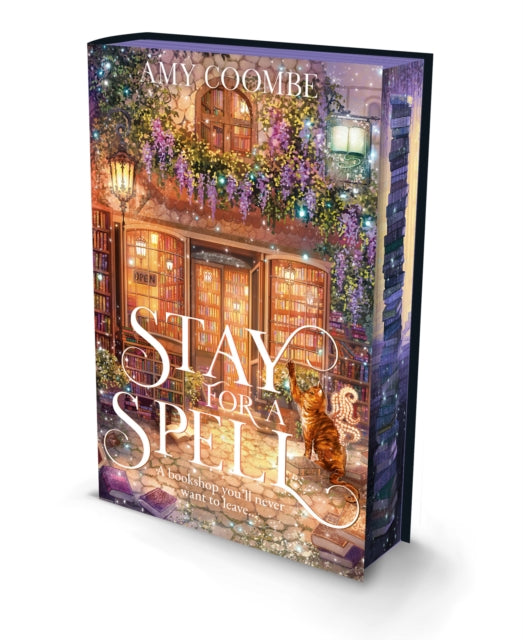 Book titled 'Stay for a Spell' by Amy Coombe with a decorative cover featuring a building and cat.