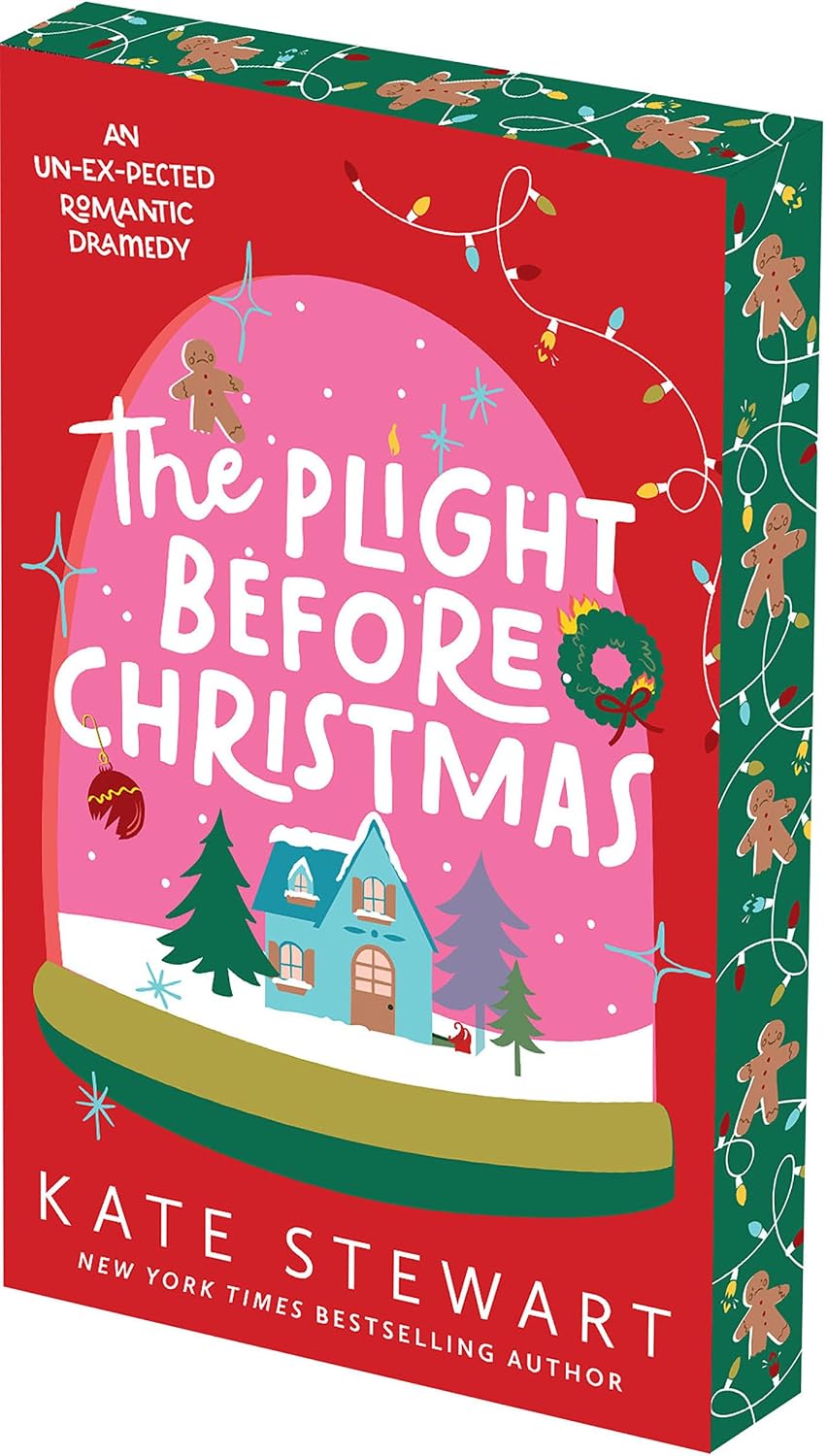 The book cover of 'The Plight Before Christmas' by Kate Stewart, featuring a festive red and pink design with a small illustrated house, Christmas trees, gingerbread men, and holiday lights on the sides.