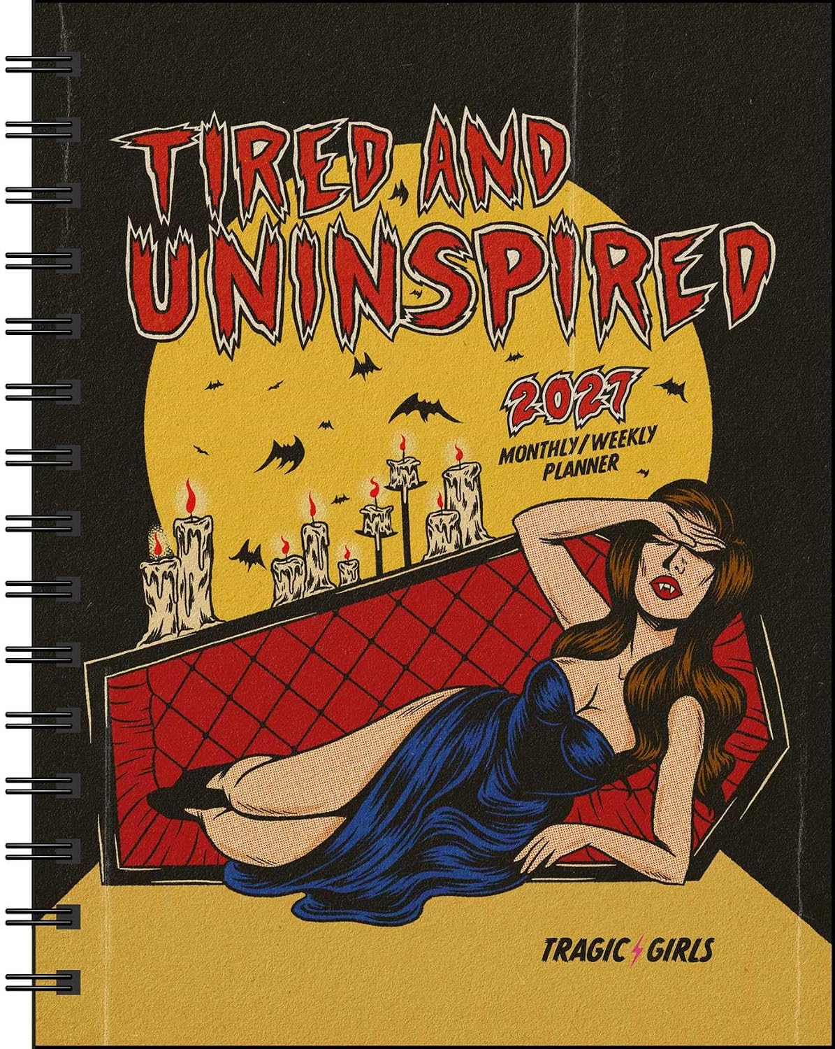 Planner cover with illustration of a woman in a coffin and text 'Tired and Uninspired' on a dark background.