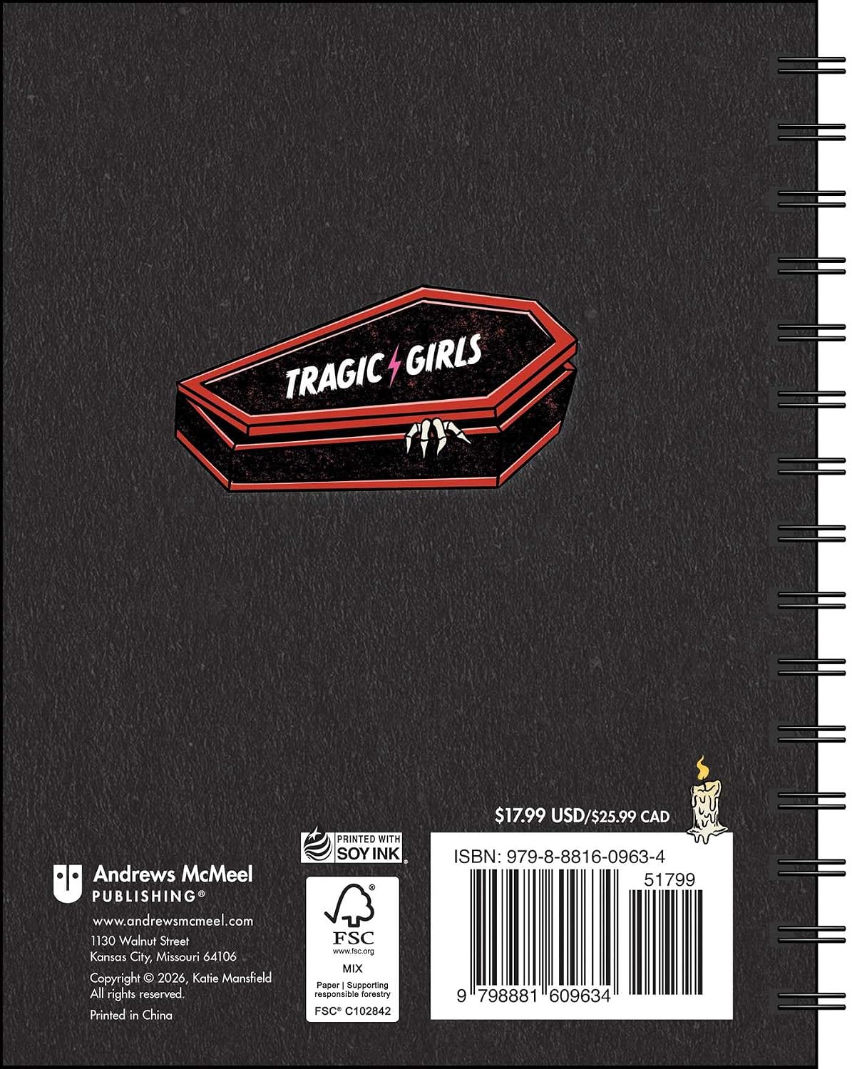 Black notebook with 'Tragic Girls' logo on a dark background