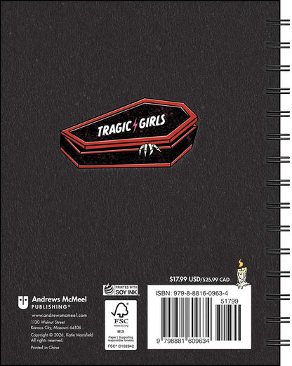 Black notebook with 'Tragic Girls' logo on a dark background